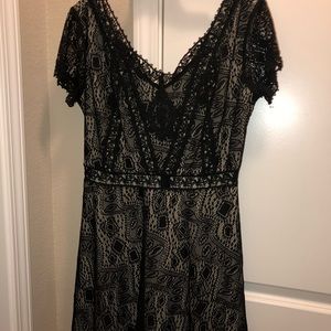 V-neck black lace dress with nude shift